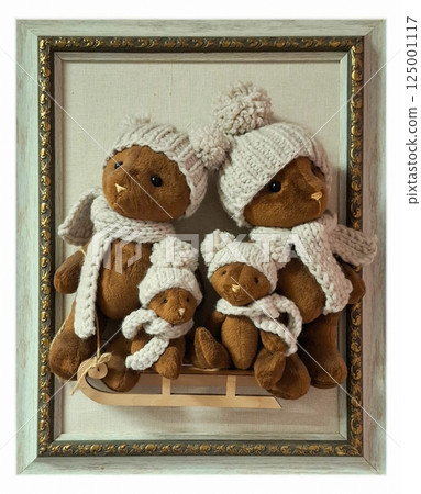 Bears on a sleigh in a frame. Creative interior design. Bears in knitted hats and scarves on a sleigh. 125001117