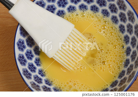 Bowl with egg wash 125001176