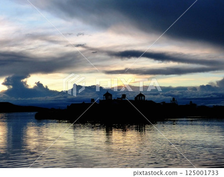 Sunset sky over the Titicaca lake Peru, Uros floating island. 125001733