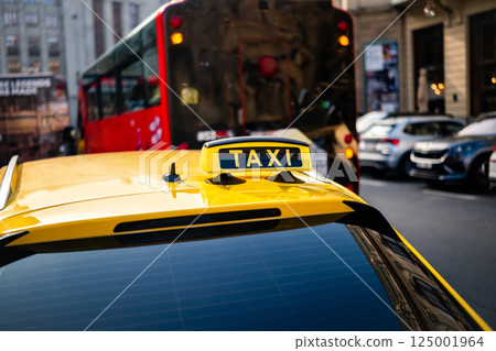 Yellow Taxi Car With Taxi Sign On A Roof Yellow Taxi Car With Taxi Sign On A Roof 125001964