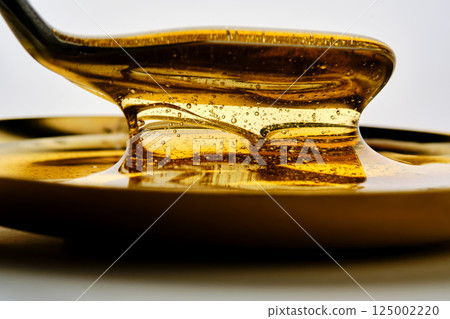 Photo of a sugar paste for depilation hair removal procedure. Texture. Photo of a sugar paste for depilation hair removal procedure. Texture. 125002220