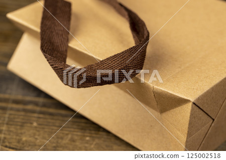 gift wrapping bag, made from recycled paper, small gift bag with brown satin ribbon handles gift wrapping bag, made from recycled paper, small gift bag with brown satin ribbon handles 125002518