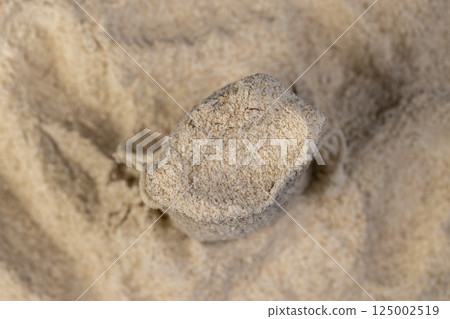 flour with bran in a bag, fresh wheat flour close-up, flour for making bread with bran 125002519