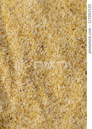 garlic for cooking close up, dried spices from very small pieces of garlic fruits, dehydrated 125002520