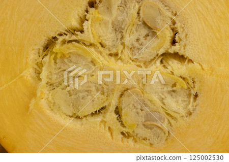 orange pumpkin on the table, orange pumpkin fruit details cut into pieces for cooking, side view orange pumpkin on the table, orange pumpkin fruit details cut into pieces for cooking, side view 125002530