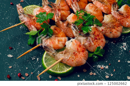 Shrimp kebab, with spices, lime, on wooden skewers, top view, no people, Shrimp kebab, with spices, lime, on wooden skewers, top view, no people, 125002662