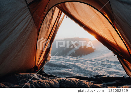 Winter sunrise view from tent in snowy mountains 125002829