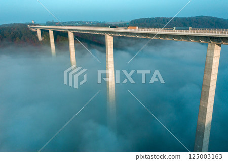 Bridge carrying A6 autobahn at sunrise over the Kocher river valley in Germany 125003163