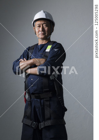 Elderly man wearing a helmet Elderly man wearing a helmet 125005298