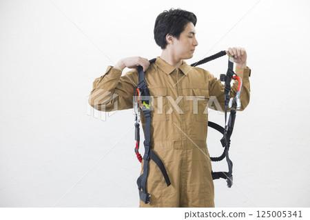 A man wearing a full harness A man wearing a full harness 125005341