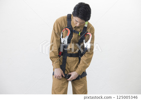 A man wearing a full harness 125005346