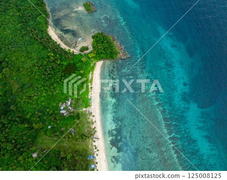 Ocean wave on sandy shoreline in Carabao Island. San Jose, Romblon. Philippines. Ocean wave on sandy shoreline in Carabao Island. San Jose, Romblon. Philippines. 125008125