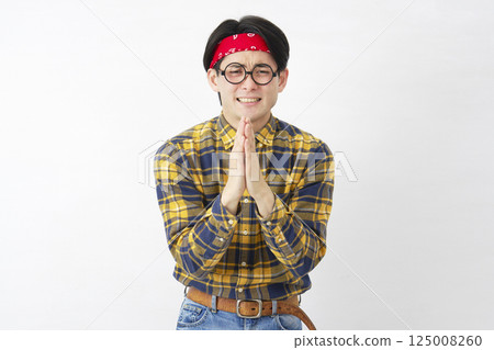 Akihabara-style man praying with hands together, pleading, white background 125008260