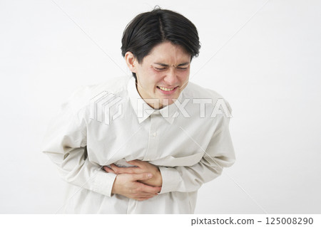 Male stomachache white background 125008290