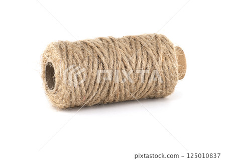 Close-up a roll of brown twine, perfect for various crafting projects. Close-up a roll of brown twine, perfect for various crafting projects. 125010837