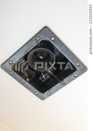 Ventilation fan being disassembled and cleaned (bathroom) 125010855
