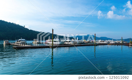 Beautiful landscape of Sun Moon Lake, sightseeing boat docked at Xuda 125011092
