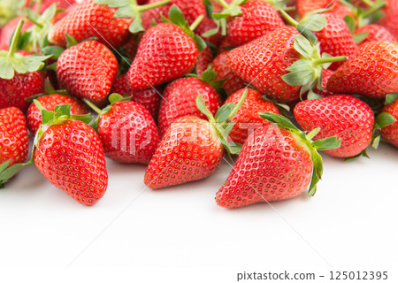 Many fresh strawberries on white background 125012395