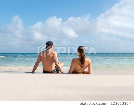 Handsome man cute woman and white sand beach Handsome man cute woman and white sand beach 125013594