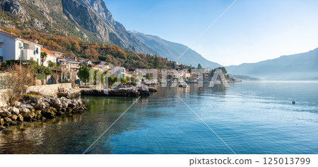 View of small village on coastline of Gulf of Kotor Bay next to Kotor town in Montenegro View of small village on coastline of Gulf of Kotor Bay next to Kotor town in Montenegro 125013799