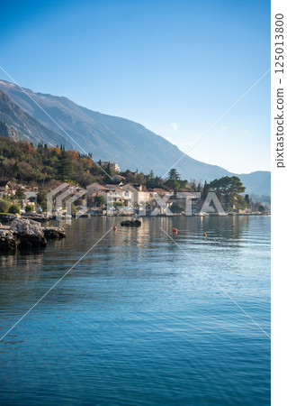 View of small village on coastline of Gulf of Kotor Bay next to Kotor town in Montenegro View of small village on coastline of Gulf of Kotor Bay next to Kotor town in Montenegro 125013800