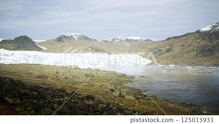 Natural beauty of a glacial landscape near a serene body of water 125013931