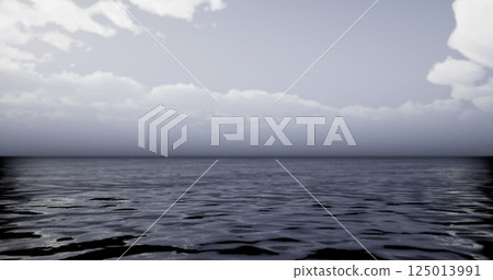 Calm ocean water reflecting cloudy sky at twilight Calm ocean water reflecting cloudy sky at twilight 125013991