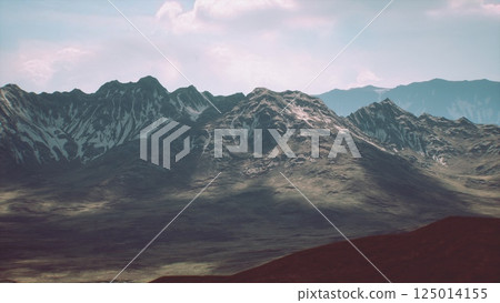 Majestic mountain range under bright sky during daytime exploration Majestic mountain range under bright sky during daytime exploration 125014155