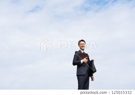 Sky and businessman Sky and businessman 125015332