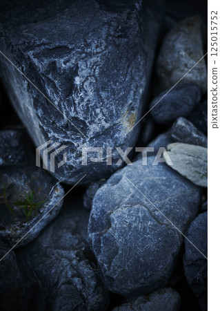 Stones in the river at dusk 125015752