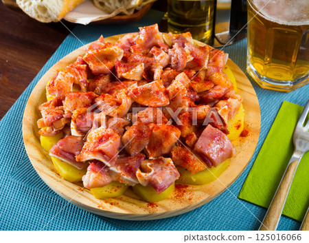 Orejas a la gallega - spanish dish. Roast pigs ears with spice Orejas a la gallega - spanish dish. Roast pigs ears with spice 125016066