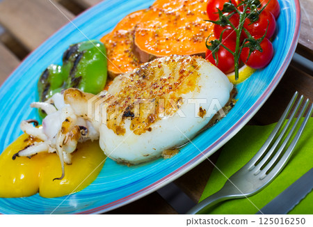 Grilled sepia served on plate 125016250
