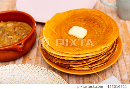 Pancakes with meat and vegetables stew machanka 125016311