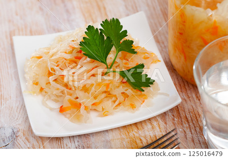 Homemade sauerkraut on white plate Homemade sauerkraut on white plate 125016479