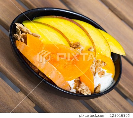 Breakfast with pumpkin and mango. 125016595