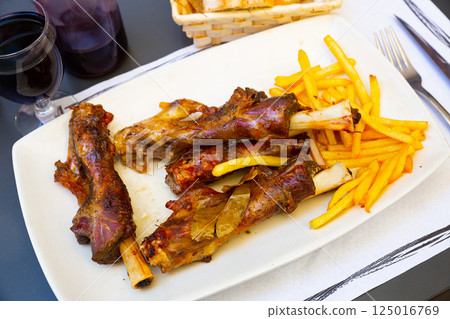 Lamb on the bone with potatoes. Spanish dish Lamb on the bone with potatoes. Spanish dish 125016769