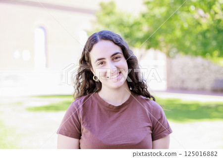 A woman relaxing in the park A woman relaxing in the park 125016882