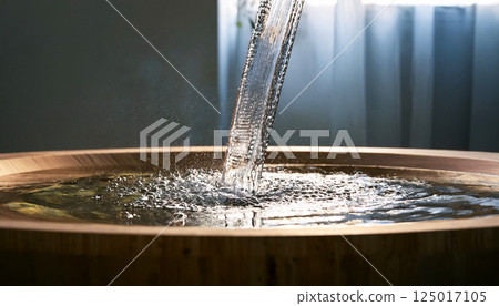 water flowing from faucet in bathroom, water flowing steadily from a chrome faucet into a clean, water flowing faucet, clean water basin, dripping water basin, water steadily dripping from a hole 125017105