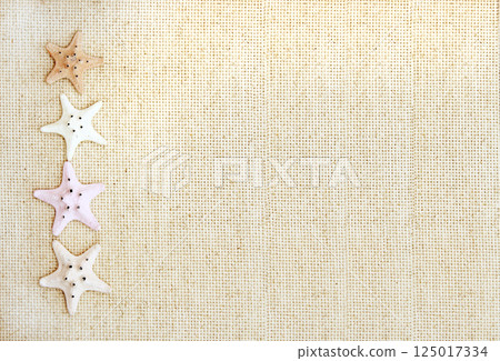 Vacations background with four starfishes on canvas texture. Topic of vacation, travel, trip abroad on vacation, cruises and tours. Mock up template. Copy space for text 125017334