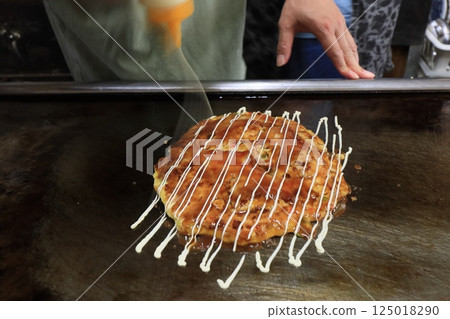 Osaka's Okonomiyaki: Freshly grilled okonomiyaki Osaka's Okonomiyaki: Freshly grilled okonomiyaki 125018290