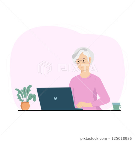 Senior woman using laptop at home. Old woman working on laptop on table at home. Online education, online shopping, communication.  125018986