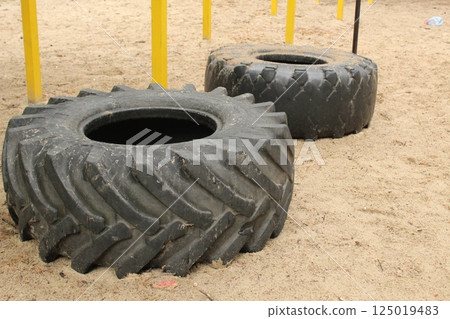 Car tires are lying on the ground. Resource reuse 125019483