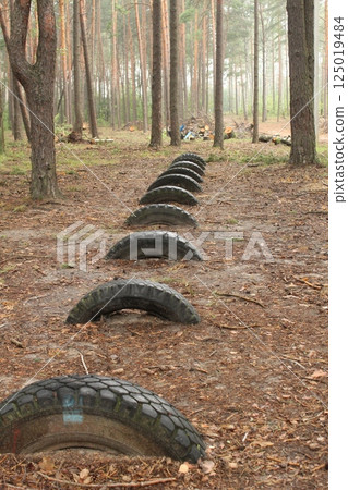 Car tires are lying on the ground. Resource reuse Car tires are lying on the ground. Resource reuse 125019484
