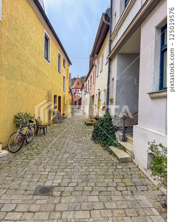 Charming cobblestone alleyway between colorful European village houses. High quality photo Charming cobblestone alleyway between colorful European village houses. High quality photo 125019576