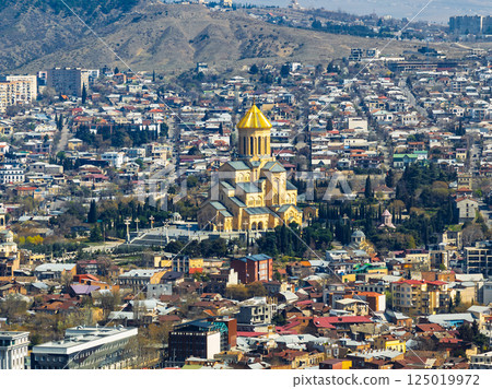 Iconic Holy Trinity Cathedral Surrounded by Tbilisi City 125019972