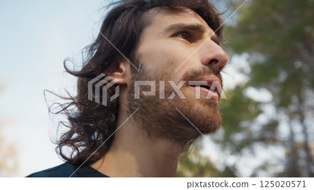 Long Haired Man Talks Suspiciously With Distrustful Passers-by in the Park Long Haired Man Talks Suspiciously With Distrustful Passers-by in the Park 125020571