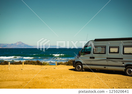 Camper van on beach, camping on nature Camper van on beach, camping on nature 125020641