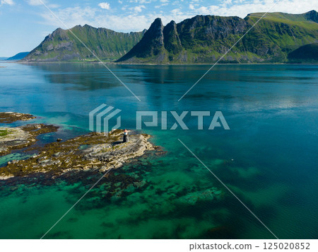 Gimsoy lighthouse on sea rocks, Lofoten Norway 125020852