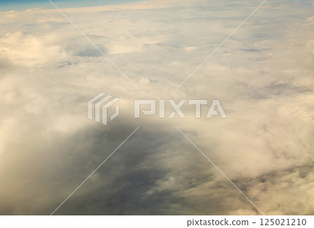 White cloudy sky. View from airplane flying in clouds. White cloudy sky. View from airplane flying in clouds. 125021210