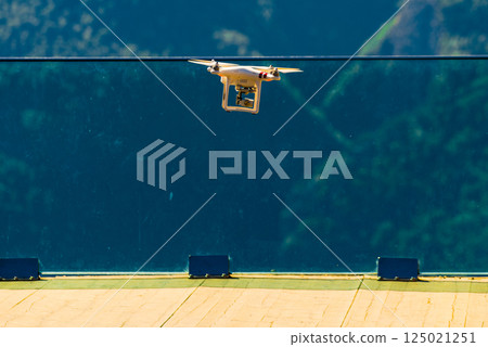 Drone flying against norwegian nature Drone flying against norwegian nature 125021251